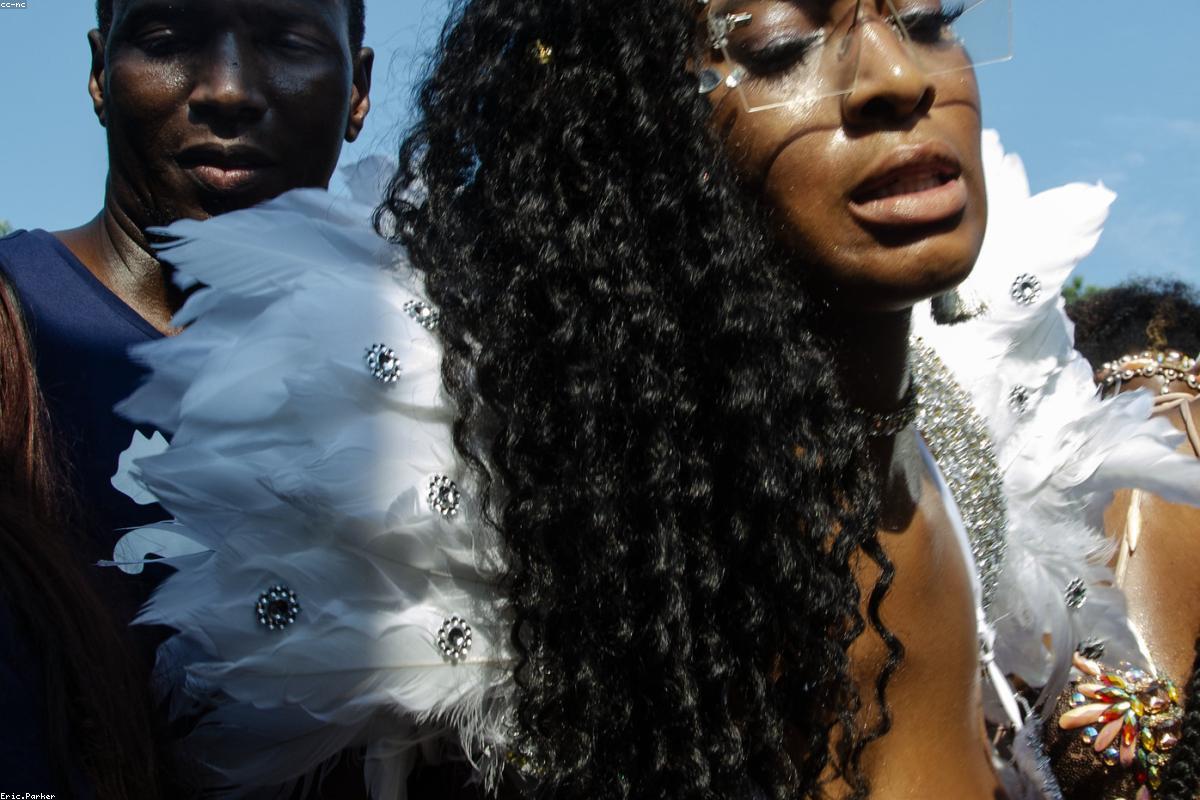 African performers in vibrant costume at a cultural celebration